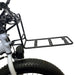 Black bike rack attached to a bicycle on a white background